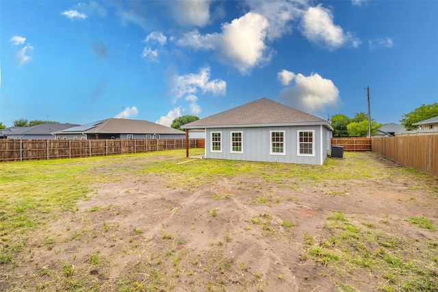 back of property featuring a lawn