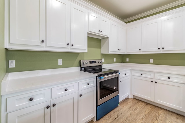 kitchen featuring ornamental molding, stainless steel range with electric stovetop, light hardwood / wood-style flooring, and white cabinetry