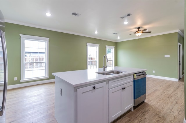 kitchen with a center island with sink, light hardwood / wood-style flooring, and plenty of natural light