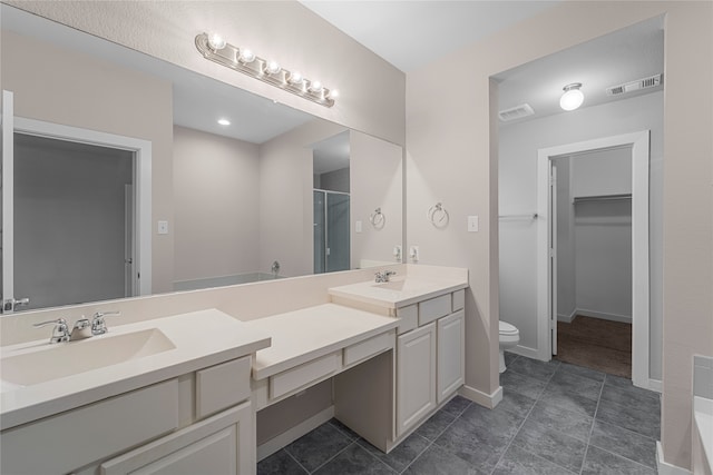 bathroom featuring vanity, toilet, and tile flooring