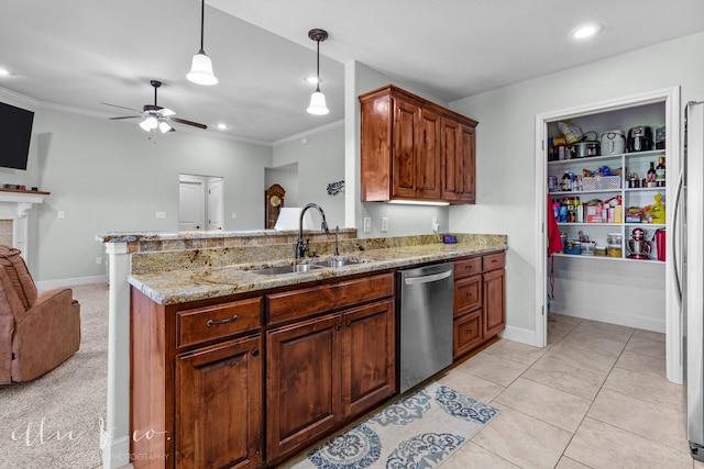 kitchen featuring hanging light fixtures, ceiling fan, stainless steel appliances, sink, and light tile floors