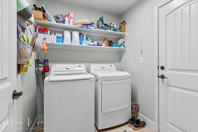 laundry room with washing machine and clothes dryer