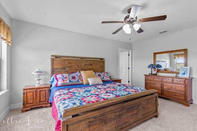 bedroom with light colored carpet and ceiling fan