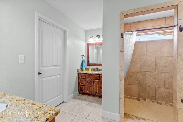 bathroom featuring vanity with extensive cabinet space, curtained shower, and tile floors