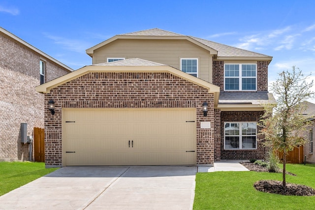 front of property featuring a garage and a front yard