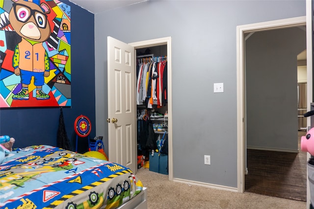 carpeted bedroom with a closet