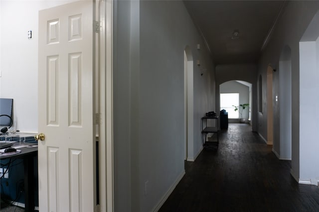 hallway with dark hardwood / wood-style floors