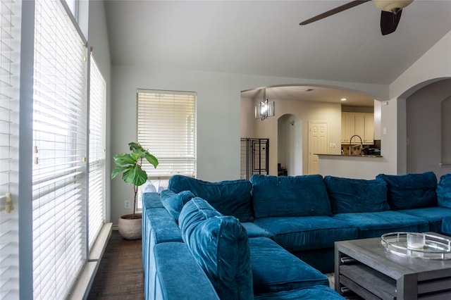 living room featuring dark hardwood / wood-style flooring, plenty of natural light, and ceiling fan