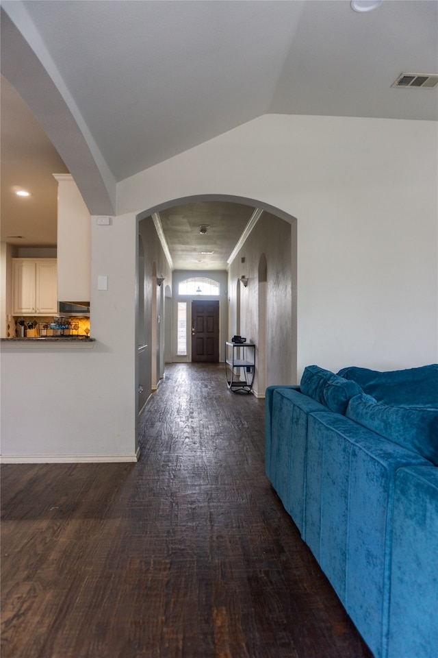 hall featuring wood-type flooring and lofted ceiling