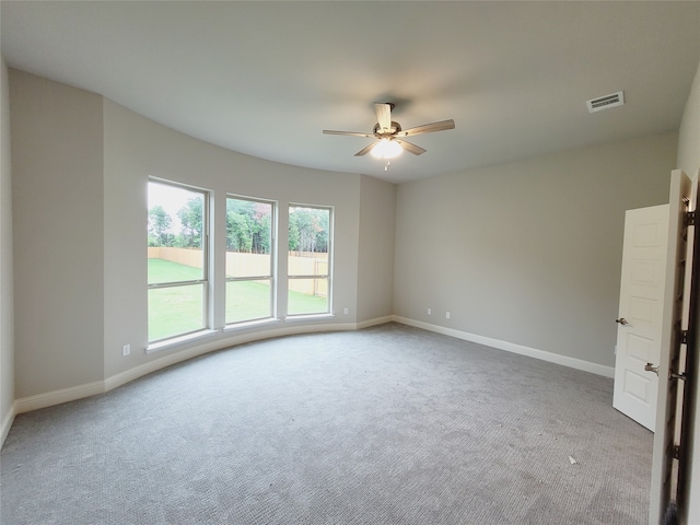 spare room with carpet floors and ceiling fan