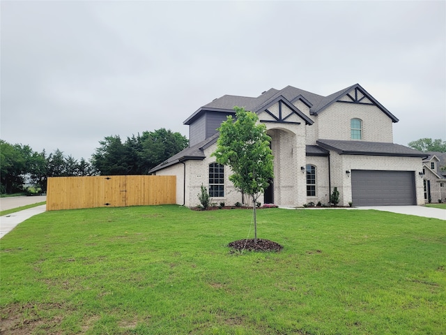 view of front of home featuring a garage and a front yard