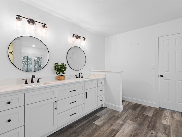 bathroom with vanity and hardwood / wood-style floors