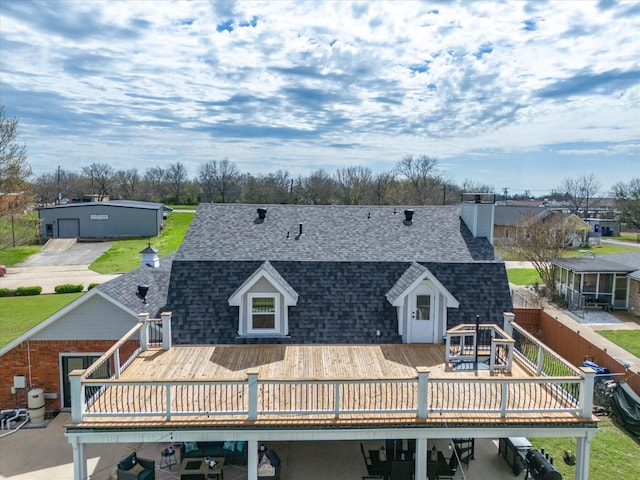 back of house featuring a deck