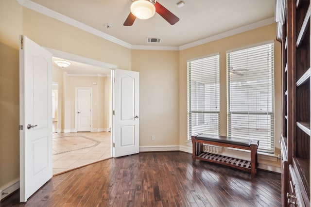 living area featuring ceiling fan, dark hardwood / wood-style flooring, and ornamental molding