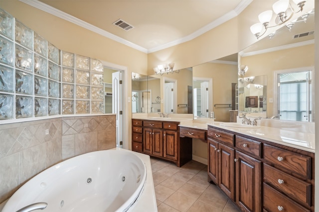 bathroom featuring tile patterned floors, a tub to relax in, ornamental molding, and vanity