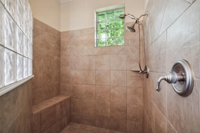 bathroom with a tile shower