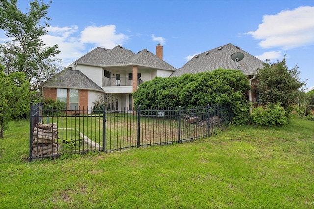 view of yard with a balcony