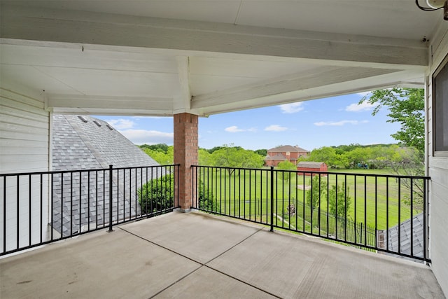 view of patio featuring a balcony