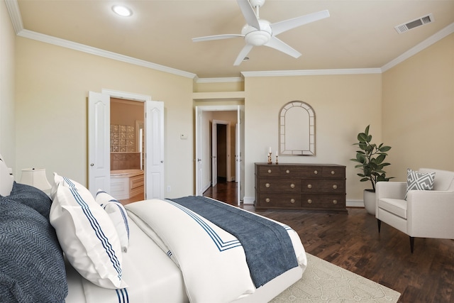 bedroom with ceiling fan, dark hardwood / wood-style flooring, crown molding, and ensuite bath