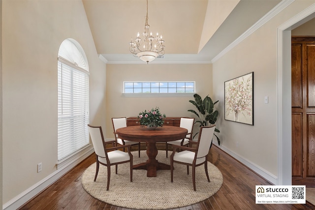 dining room with dark wood-type flooring, a wealth of natural light, and an inviting chandelier