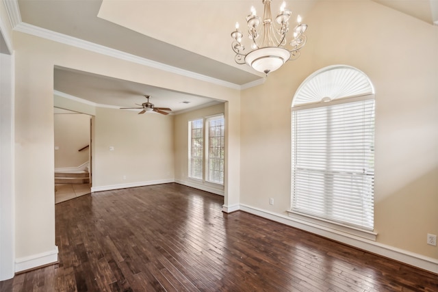 spare room featuring crown molding, dark wood-type flooring, and ceiling fan with notable chandelier