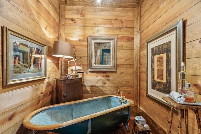 interior space with wooden walls and a washtub