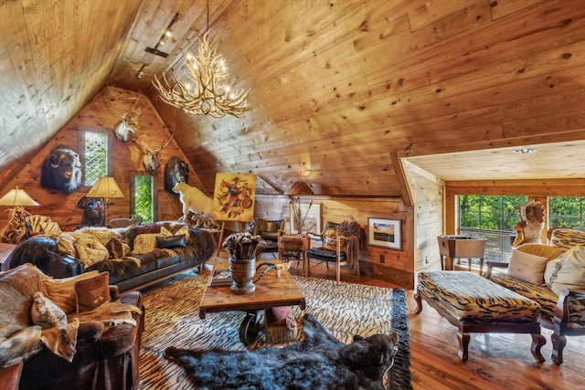 living room featuring lofted ceiling, wooden ceiling, hardwood / wood-style floors, wood walls, and a notable chandelier