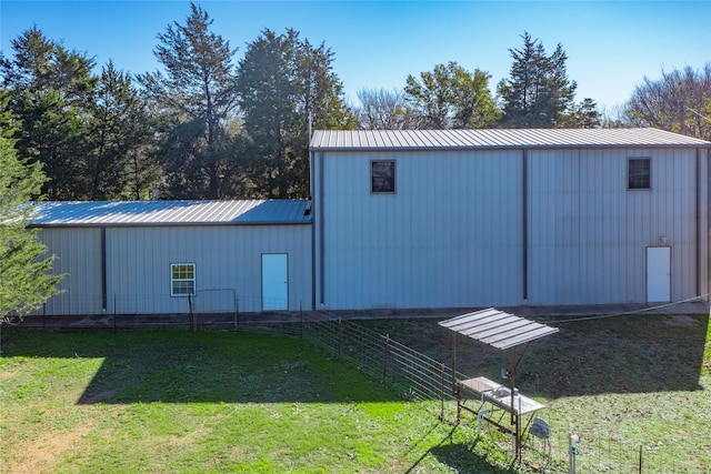 view of outbuilding with a lawn