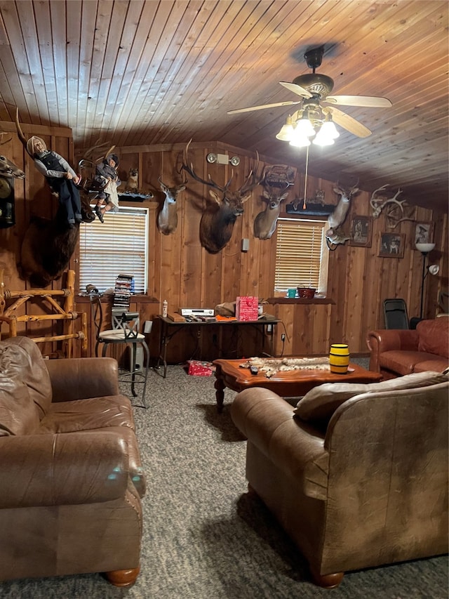 carpeted living room featuring wooden ceiling, wooden walls, vaulted ceiling, and ceiling fan