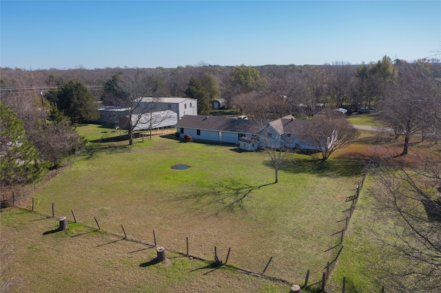 birds eye view of property with a rural view