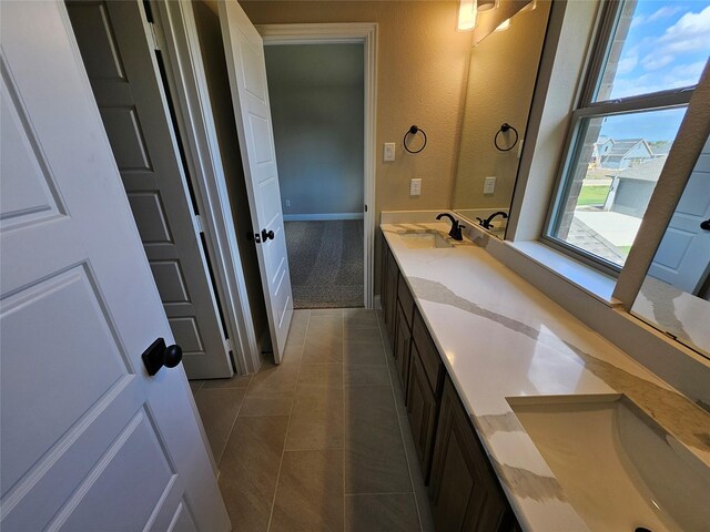 bathroom with vanity and tile patterned floors