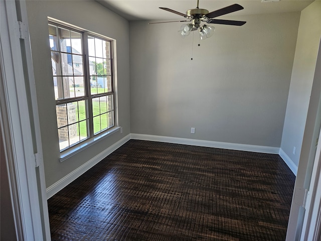 spare room featuring hardwood / wood-style floors and ceiling fan