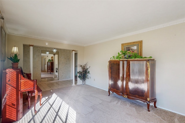 sitting room featuring ornamental molding and light colored carpet