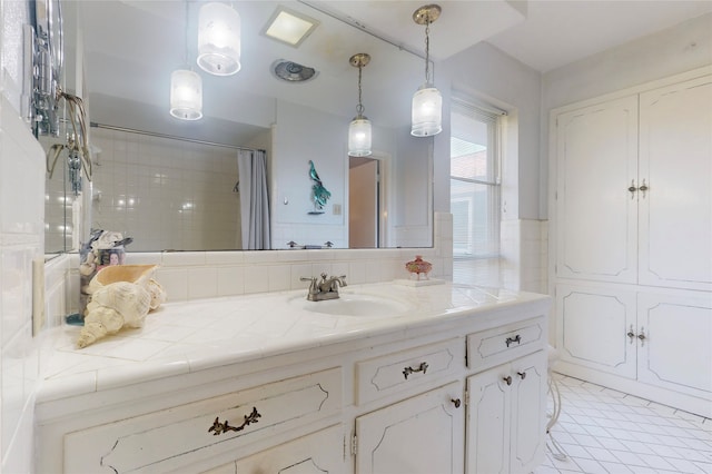 bathroom featuring vanity, decorative backsplash, a shower with curtain, and tile patterned floors