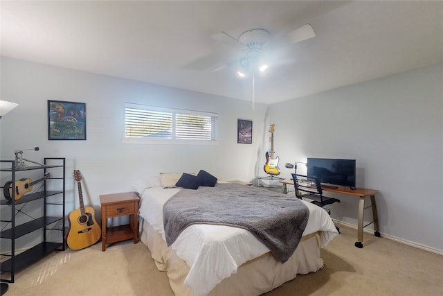 bedroom with light colored carpet and ceiling fan