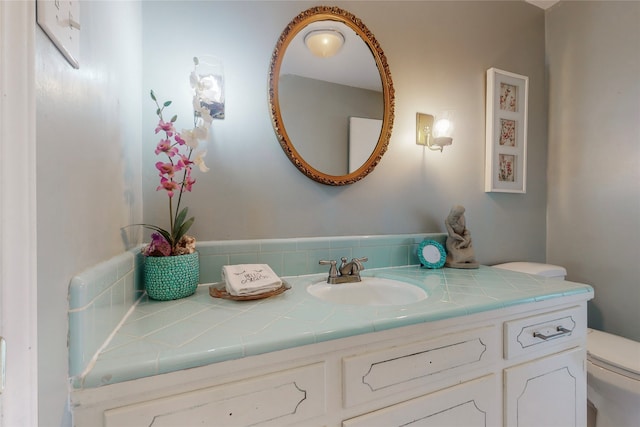 bathroom with vanity and toilet