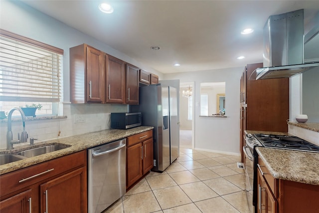 kitchen with stainless steel appliances, range hood, sink, light tile patterned floors, and light stone counters