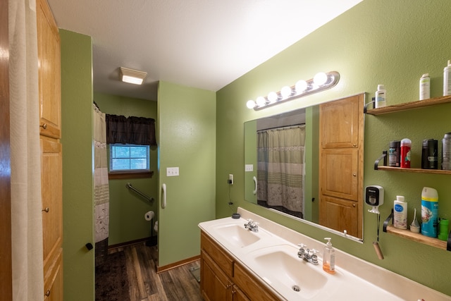 bathroom with vanity and hardwood / wood-style floors