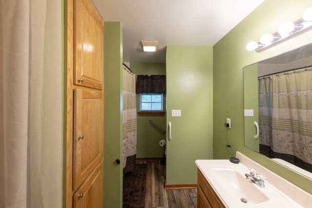 bathroom featuring hardwood / wood-style flooring and vanity