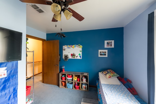 bedroom with ceiling fan and carpet floors