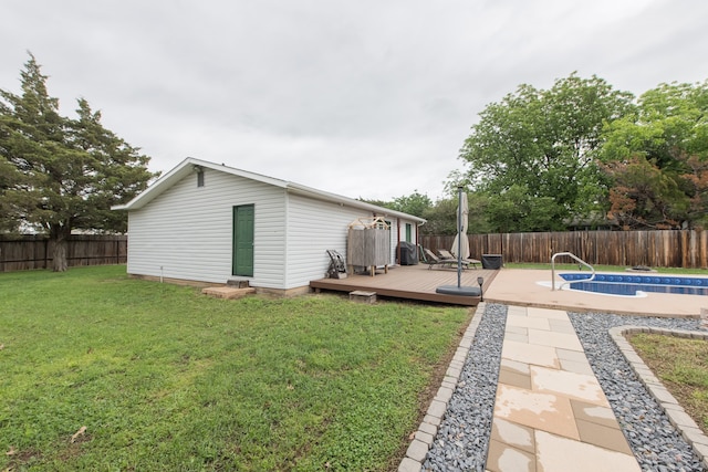 view of yard with a pool side deck