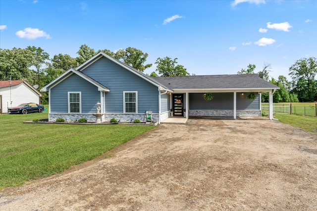 ranch-style home featuring a front yard and a carport