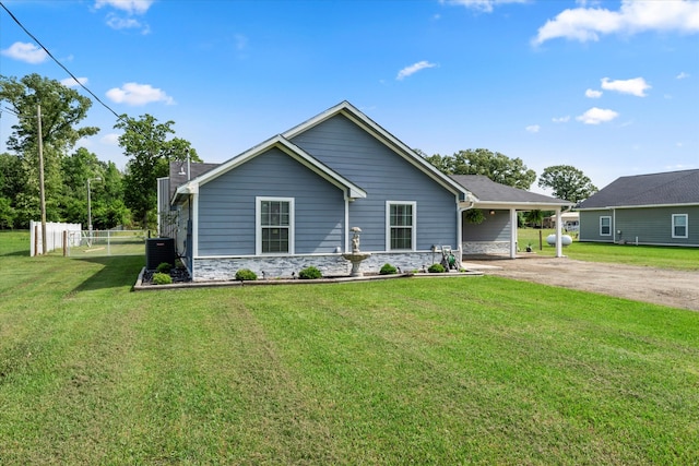 view of front facade with central AC and a front yard