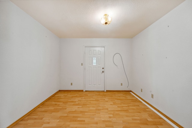 spare room featuring light wood-type flooring