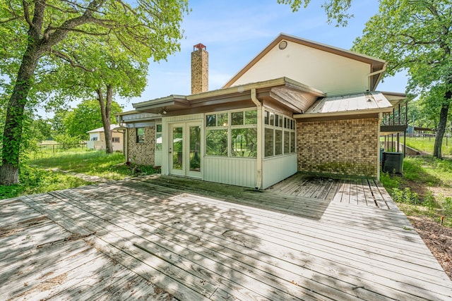 wooden terrace featuring french doors and central AC