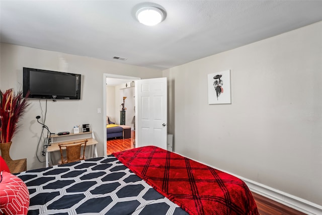 bedroom featuring wood-type flooring