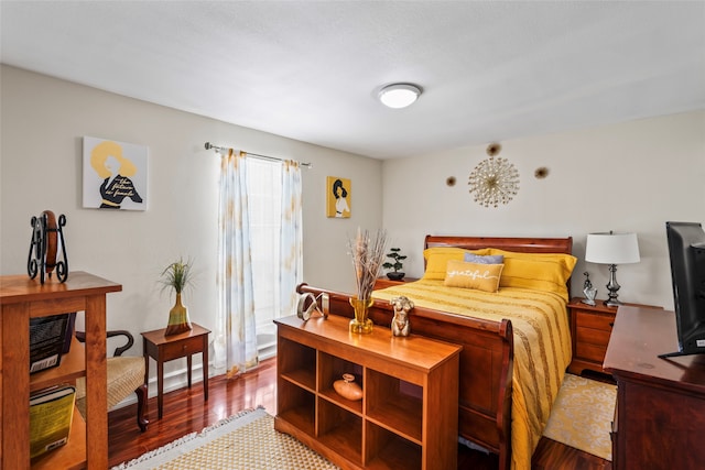 bedroom with hardwood / wood-style floors