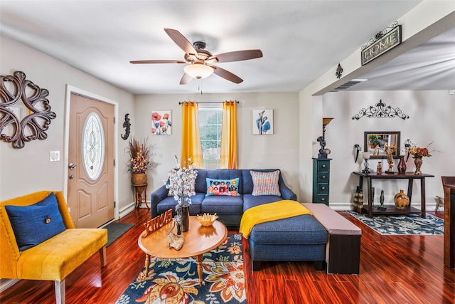 living room featuring hardwood / wood-style flooring and ceiling fan