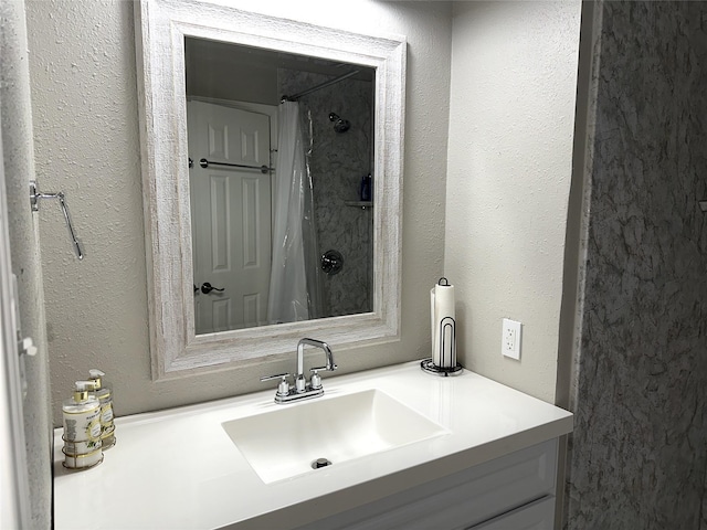 bathroom with a shower with curtain and vanity