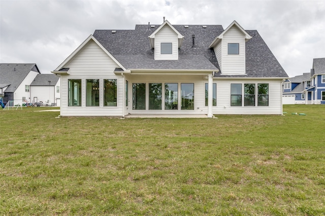 back of house featuring a lawn